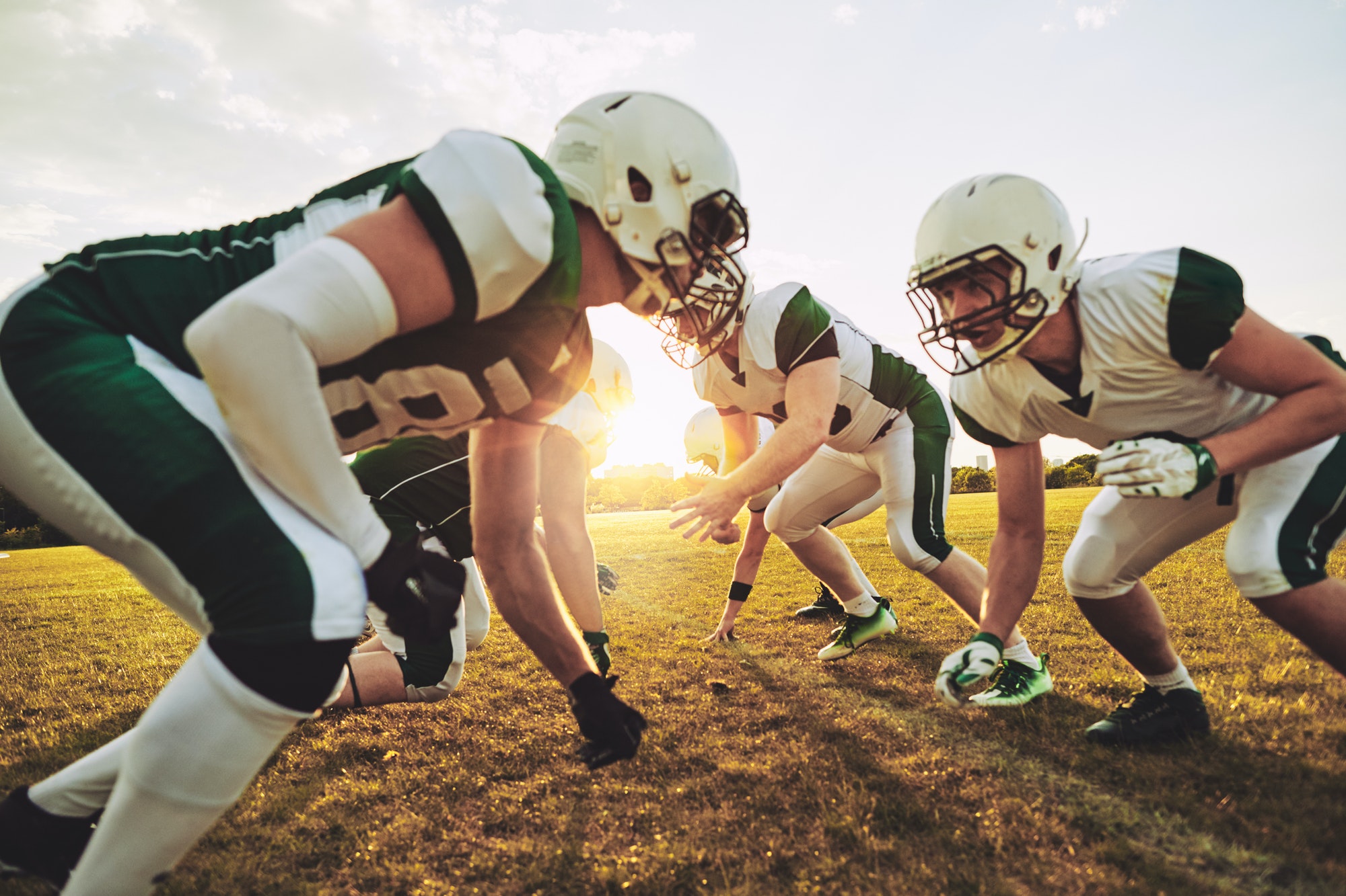 american-football-players-crouching-in-formation-during-a-team-practice.jpg